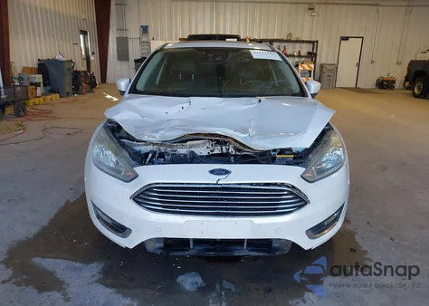 2015 Ford Focus Titanium z USA, uszkodzony, nr VIN 1FADP3N29FL314235